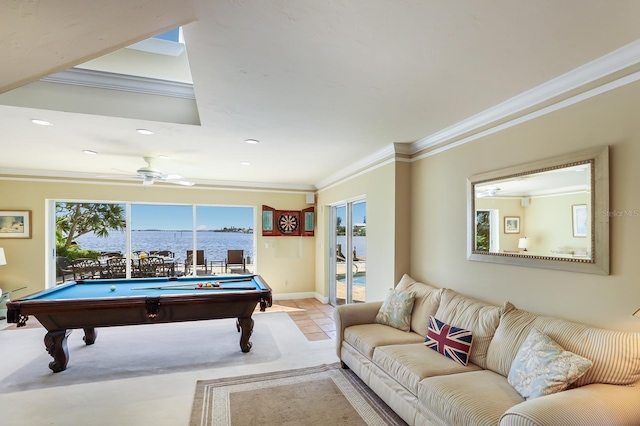 recreation room with ceiling fan, billiards, ornamental molding, a water view, and light tile patterned floors