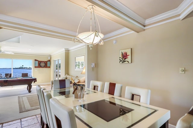 dining space with ornamental molding, a water view, and billiards