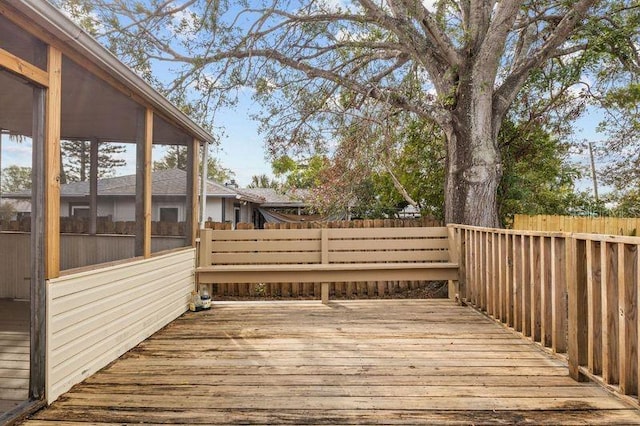 wooden terrace featuring a sunroom