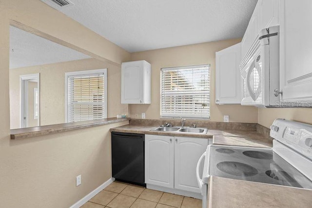 kitchen with white appliances, a textured ceiling, white cabinetry, light tile patterned floors, and sink