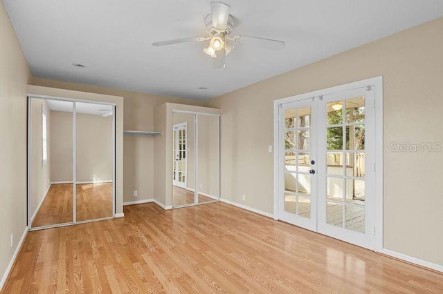 unfurnished bedroom with ceiling fan, french doors, and light wood-type flooring