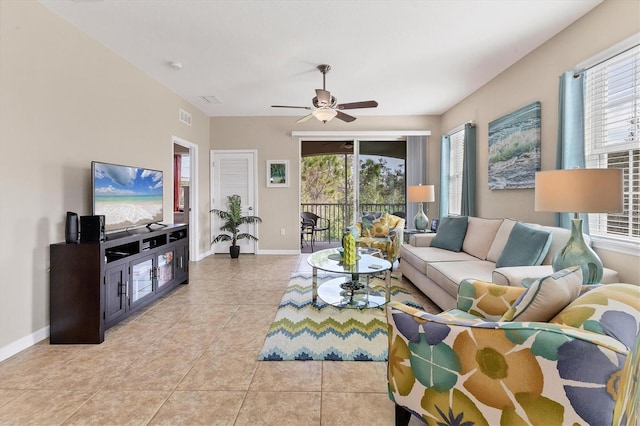 living room with plenty of natural light, ceiling fan, and light tile patterned flooring