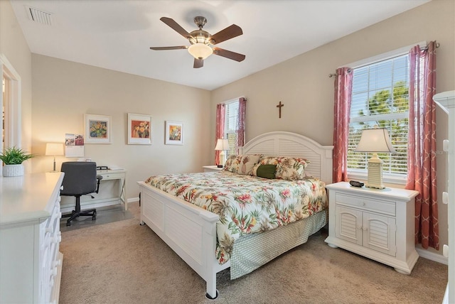 carpeted bedroom featuring ceiling fan