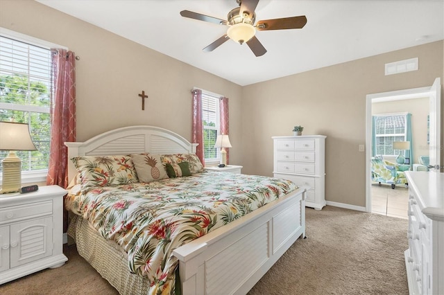 bedroom featuring ceiling fan and light carpet