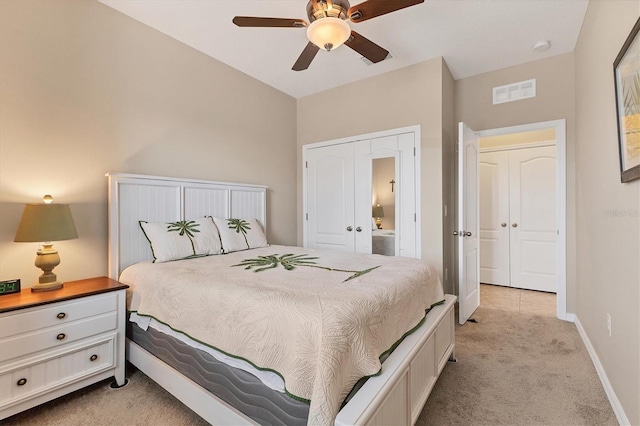 bedroom featuring light colored carpet and ceiling fan