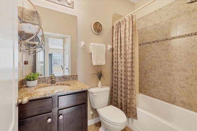 full bathroom with shower / tub combo with curtain, vanity, and toilet