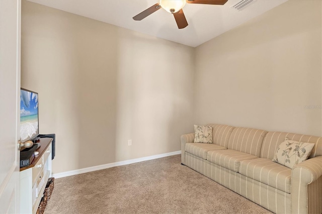 living room with light colored carpet and ceiling fan