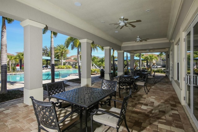 view of patio / terrace featuring a community pool and ceiling fan