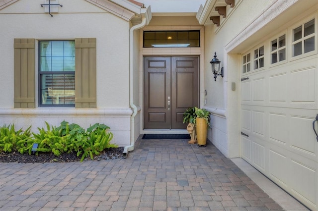 entrance to property featuring a garage