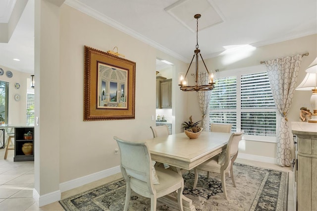 tiled dining room featuring ornamental molding and a notable chandelier