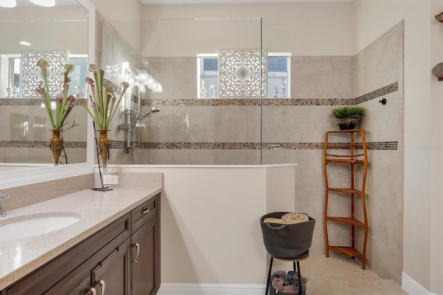 bathroom featuring a shower, tile patterned flooring, and vanity