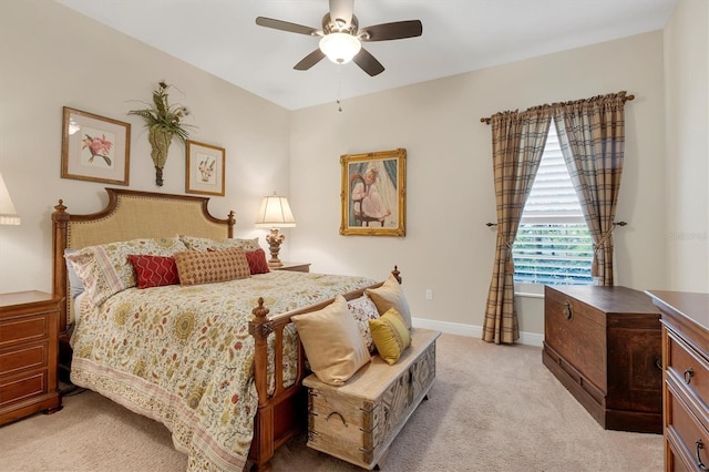 bedroom featuring ceiling fan and light carpet