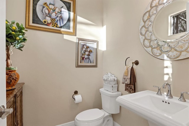 bathroom with sink and toilet