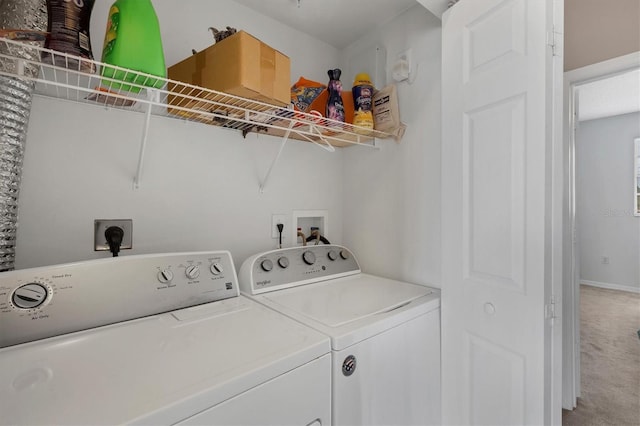 laundry area featuring separate washer and dryer and carpet