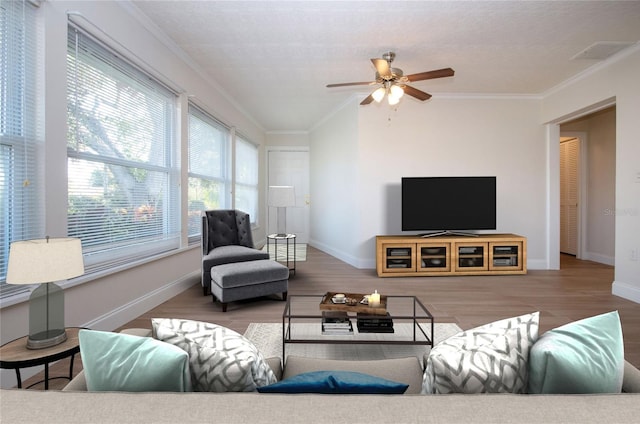 living room featuring ceiling fan, wood-type flooring, and crown molding