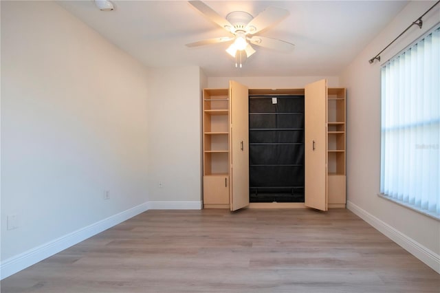 unfurnished room with light hardwood / wood-style floors and ceiling fan