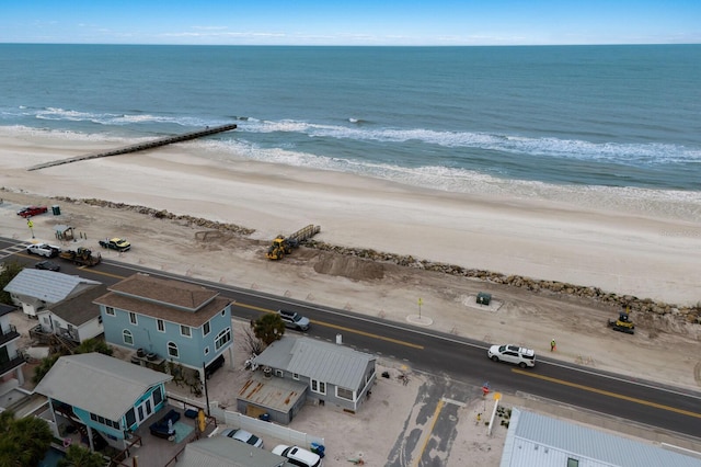 aerial view with a view of the beach and a water view