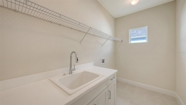 laundry room with cabinets, sink, and hookup for a washing machine