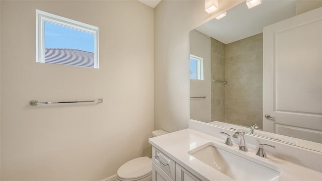 bathroom with toilet and vanity