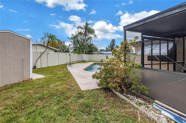 view of swimming pool featuring a lanai, a patio area, and a lawn