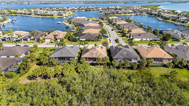 bird's eye view with a water view and a residential view