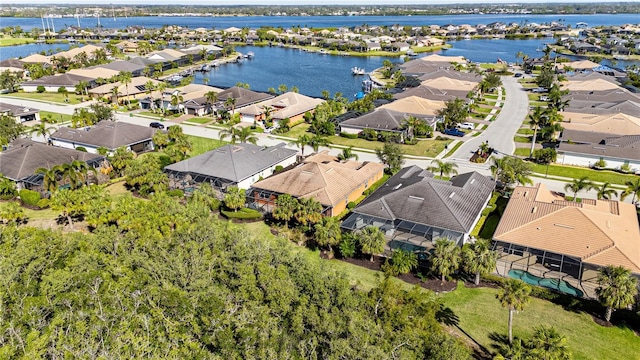 aerial view featuring a water view and a residential view