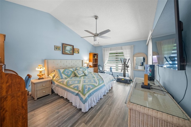 bedroom with ceiling fan, lofted ceiling, hardwood / wood-style floors, and a textured ceiling