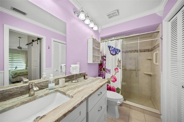 bathroom featuring crown molding, tile patterned flooring, vanity, curtained shower, and toilet