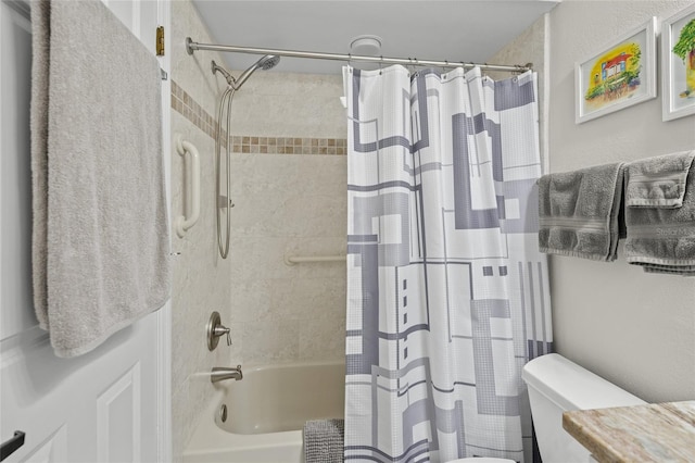 bathroom with toilet and shower / bath combo with shower curtain