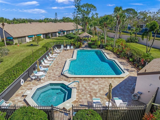 view of pool featuring a community hot tub and a patio