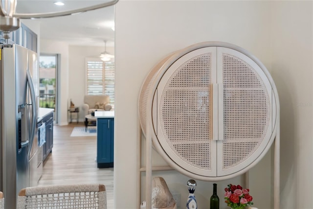 details featuring stainless steel fridge with ice dispenser