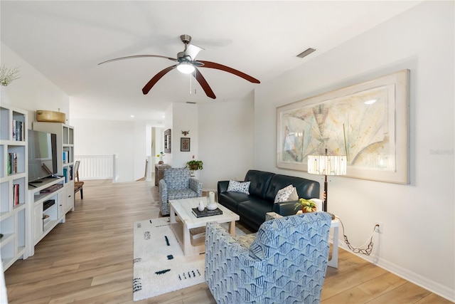 living room with light hardwood / wood-style flooring