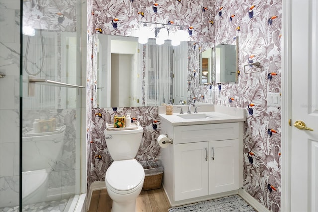 bathroom with vanity, toilet, walk in shower, and hardwood / wood-style floors