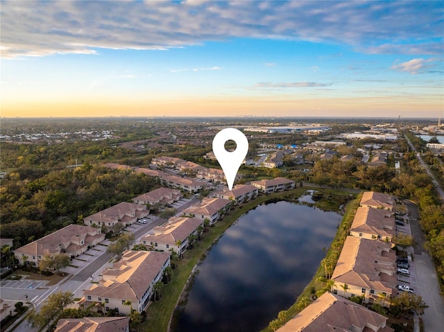 aerial view at dusk with a water view