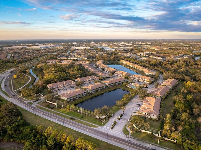 aerial view at dusk with a water view