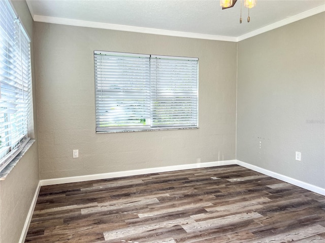 unfurnished room with dark wood-type flooring and ornamental molding