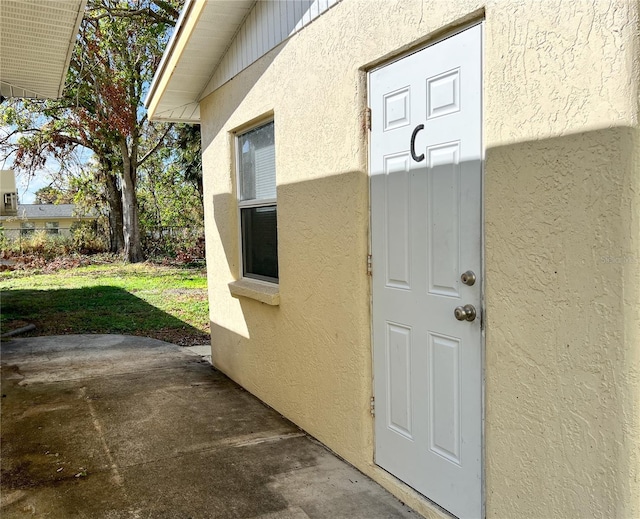 doorway to property featuring a patio