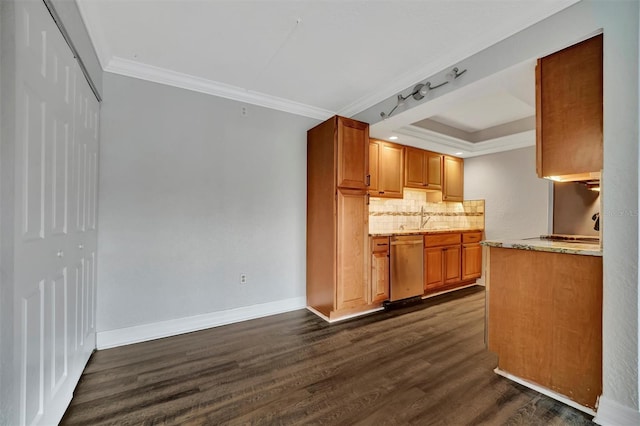 kitchen with dark hardwood / wood-style floors, tasteful backsplash, dishwasher, ornamental molding, and sink