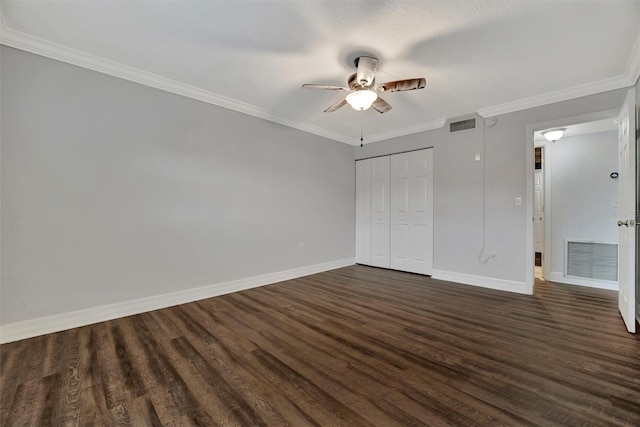 unfurnished bedroom with ceiling fan, dark hardwood / wood-style floors, a closet, and ornamental molding