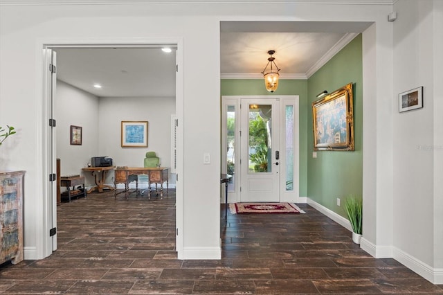 foyer entrance featuring dark hardwood / wood-style flooring and crown molding