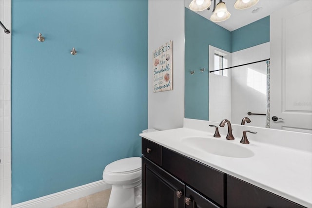 bathroom featuring walk in shower, vanity, toilet, and tile patterned flooring