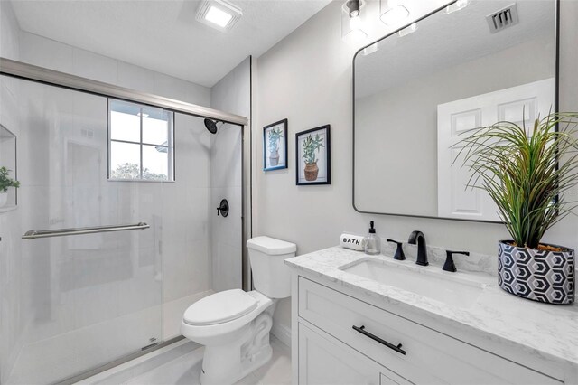 14146 Cattle Egret Pl, Bradenton, FL 34202 - bathroom featuring toilet, vanity, and walk in shower
