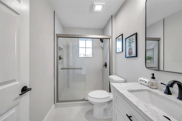14146 Cattle Egret Pl, Bradenton, FL 34202 - bathroom featuring a textured ceiling, toilet, vanity, and an enclosed shower