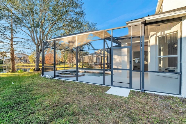 14146 Cattle Egret Pl, Bradenton, FL 34202 - view of yard featuring glass enclosure and a water view