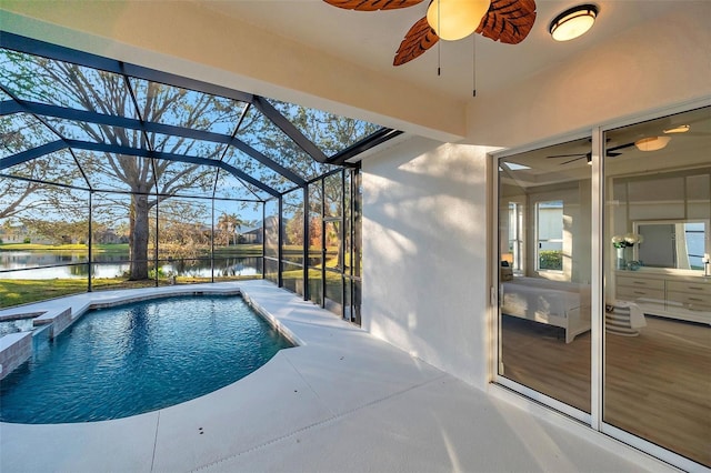 14146 Cattle Egret Pl, Bradenton, FL 34202 - view of swimming pool with ceiling fan, glass enclosure, a water view, and a patio