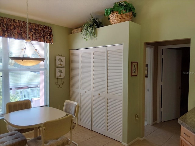 dining space with light tile patterned flooring