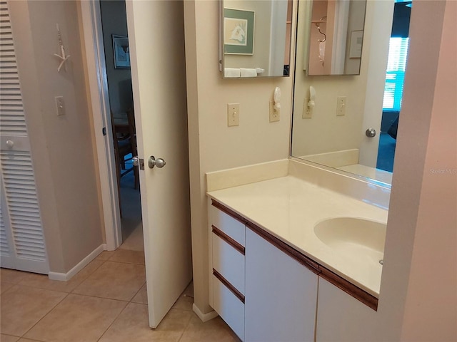 bathroom with tile patterned flooring and vanity