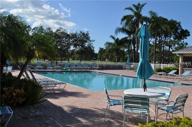 view of swimming pool featuring a patio area