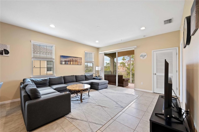 tiled living room with a wealth of natural light