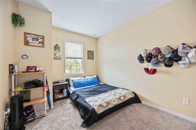 bedroom with light colored carpet